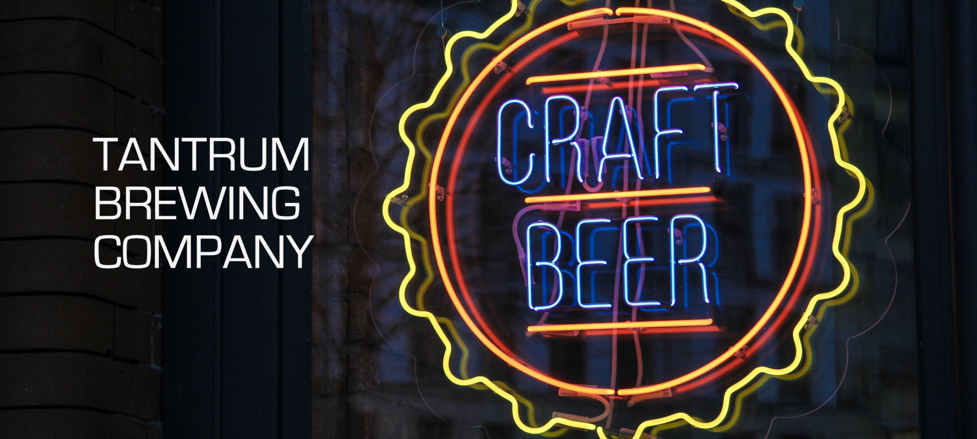 Neon beer sign that says "Craft Beer" with title "Tantrum Brewing Company".