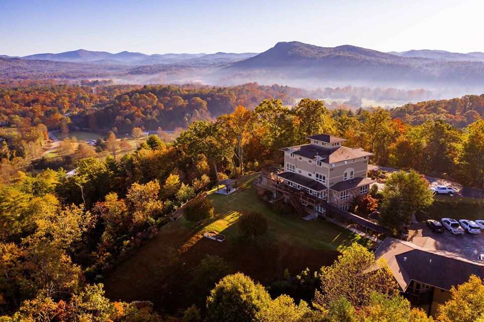 A bird's eye view of Lucille's Mountain Top Inn & Spa. The property is surrounded by the rolling hills of the Blue Ridge Mountains.