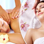 One woman laying on her back wrapped in a white Towel with flowers around her. Another woman laying on her stomach getting a shoulder massage