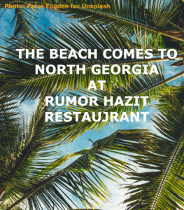 palm fronds against a blue sky with title: The Beach comes to North Georgia at Rumor Hazit Restaurant