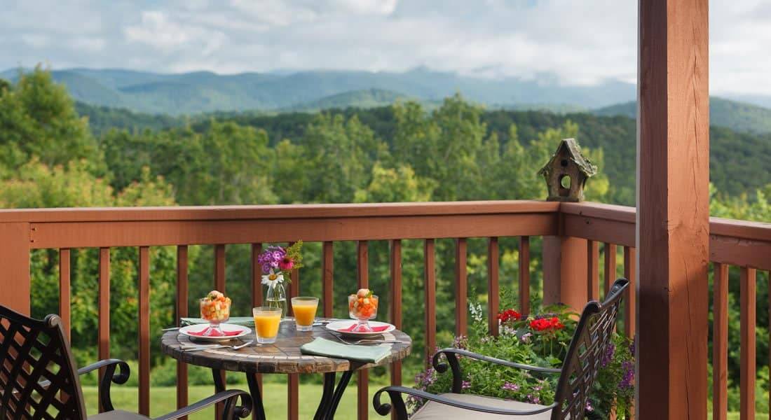 Deck off on of the rooms with Fruit and Orange Juice with a view of the Mountains