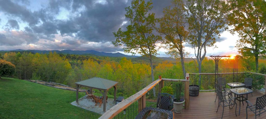 The back porch at Lucille's Mountain Top Inn provides miles of mountain views. The large porch has plenty of space for several tables and chairs.